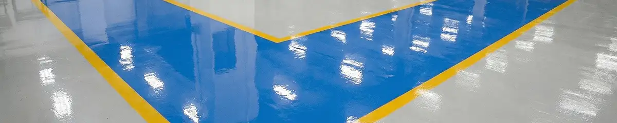A factory floor professionally covered and marked with epoxy flooring in Akron, OH