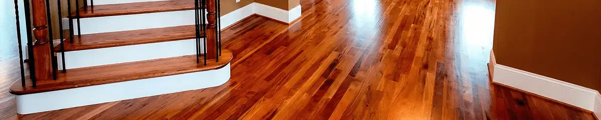 Base floor of a staircase with professionally restored wood flooring in Akron OH