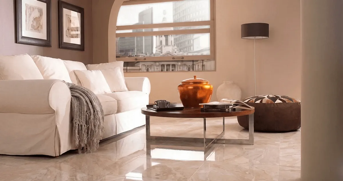Modern living room with professionally installed marble flooring, a beige sofa, coffee table in Akron, OH