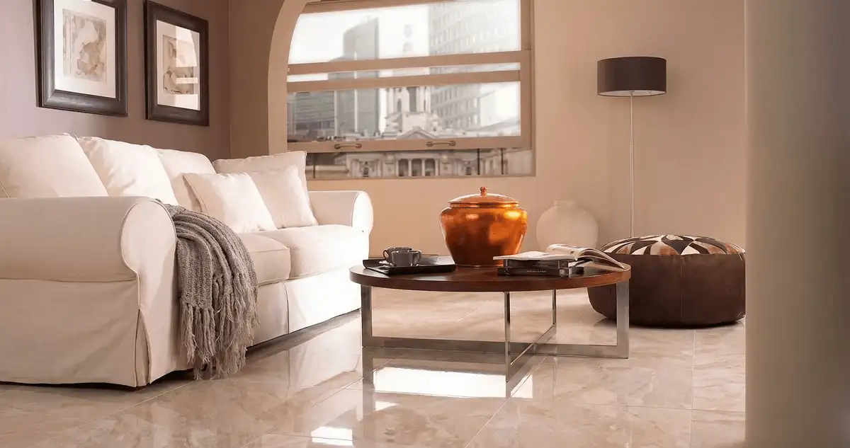 Modern living room with professionally installed marble flooring, a beige sofa, coffee table in Akron, OH