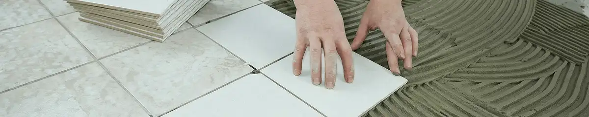 Professional installing white tile floors in Akron, OH