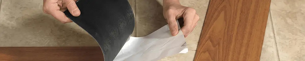 A professional installing vinyl flooring in Akron, OH